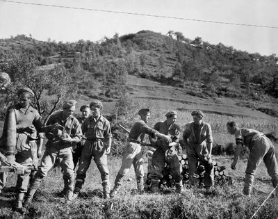 British troops stacking shells, Italy, 1944 by English Photographer
